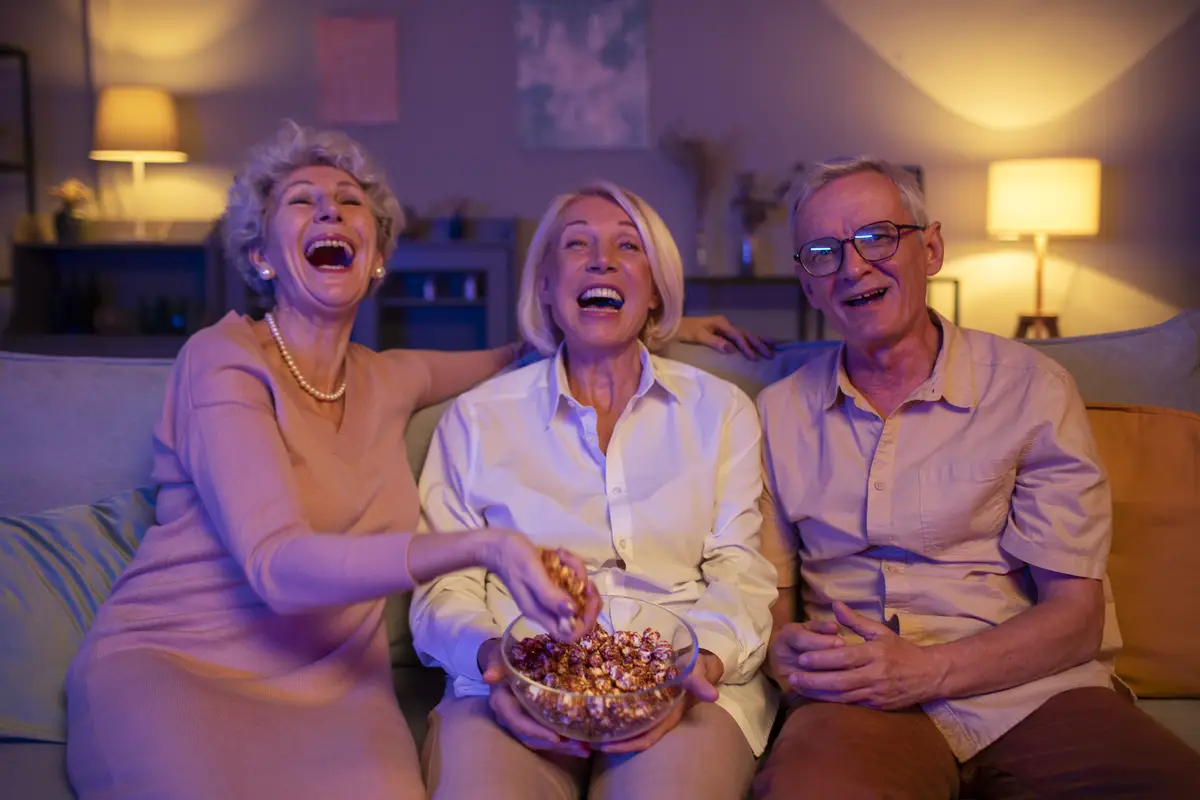 Senior friends having a party at night