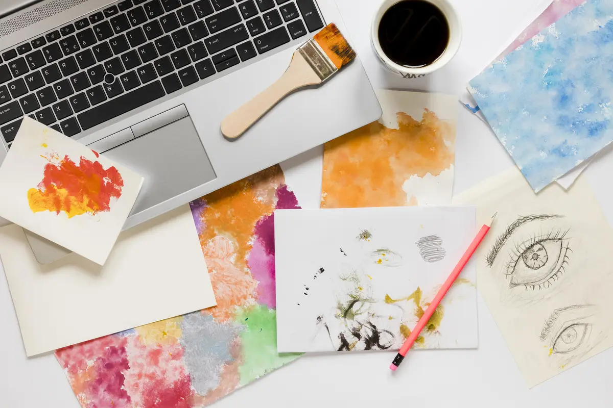 Laptop and artist painting tools