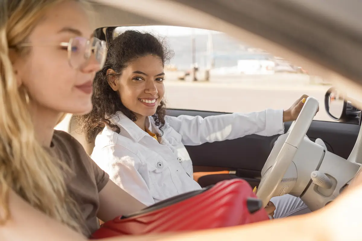 Close-up women traveling by car