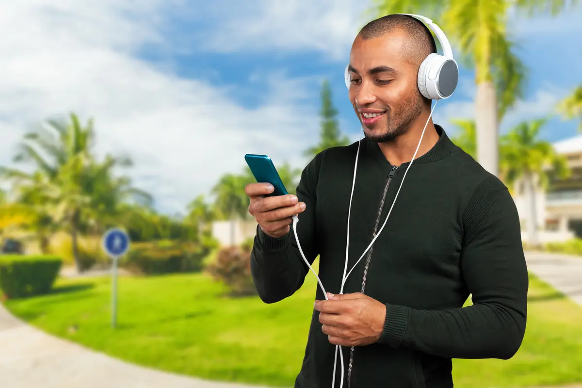 Handsome afro american man is listening to music