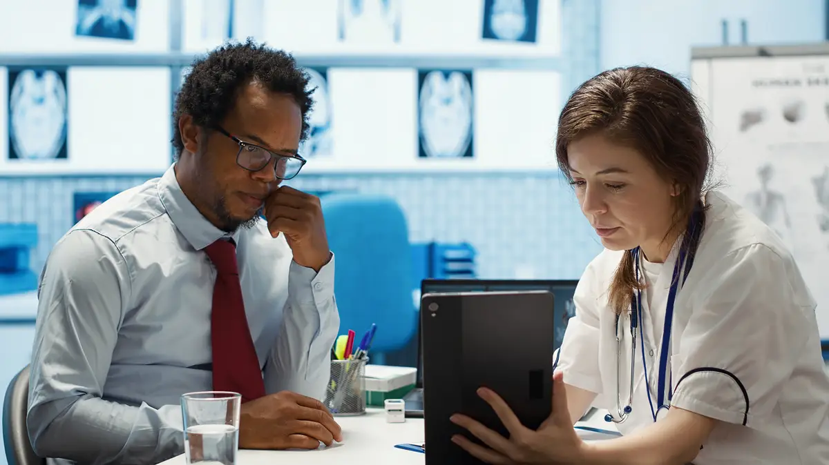 General practitioner presenting the test findings via scan interpretation on tablet