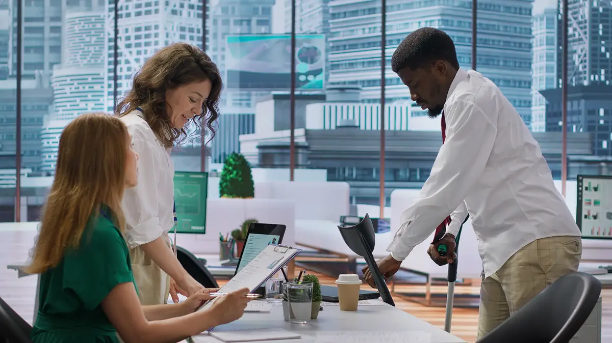 Businessman walking in crutches attending a job interview for the new position
