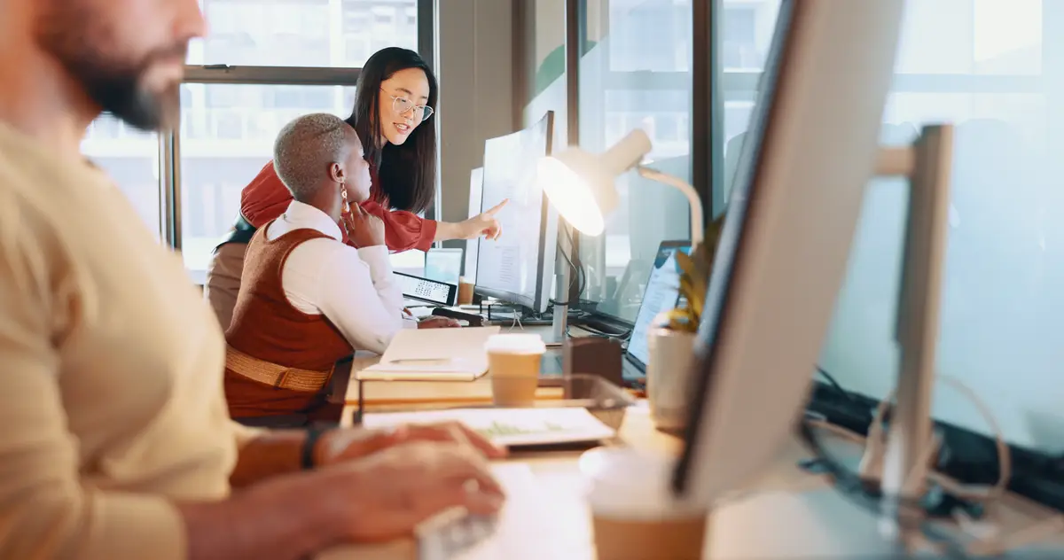 Training human resources and coaching with a female manager and colleague working together in the office Teamwork management and review with a business woman talking to a coworker at work