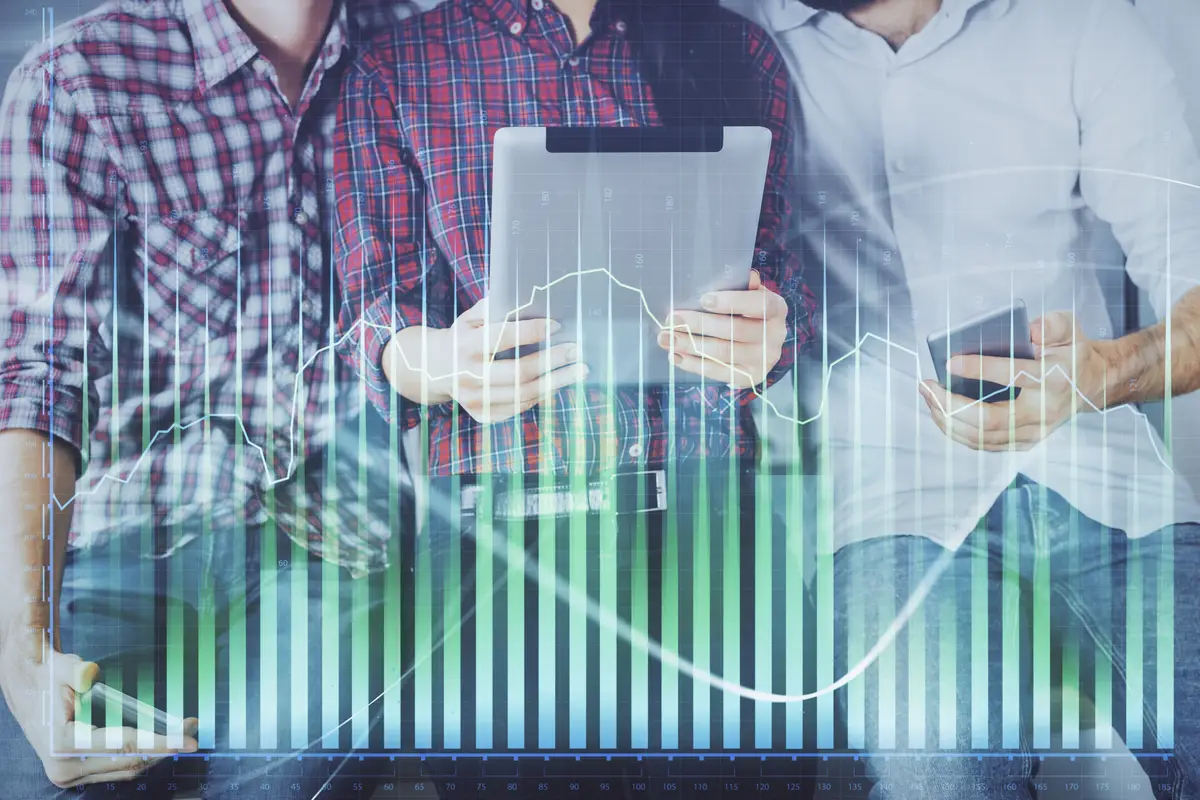 Double exposure of forex graph drawing and man and woman working together holding and using a mobile device Trade concept