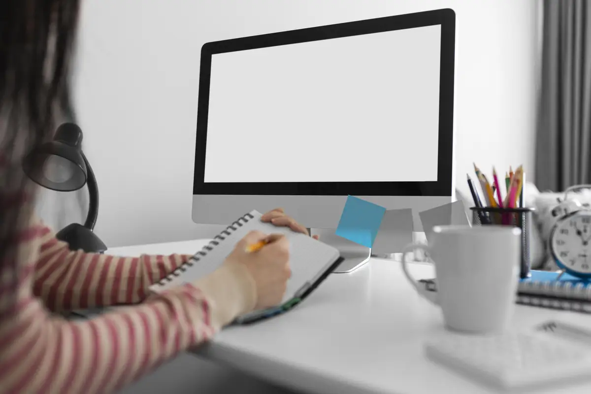 Close up student taking notes