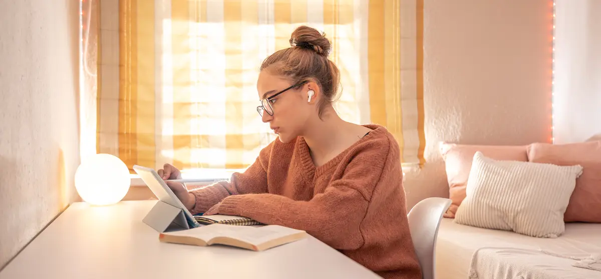 A girl student is talking on the phone at home Conversation on the phone