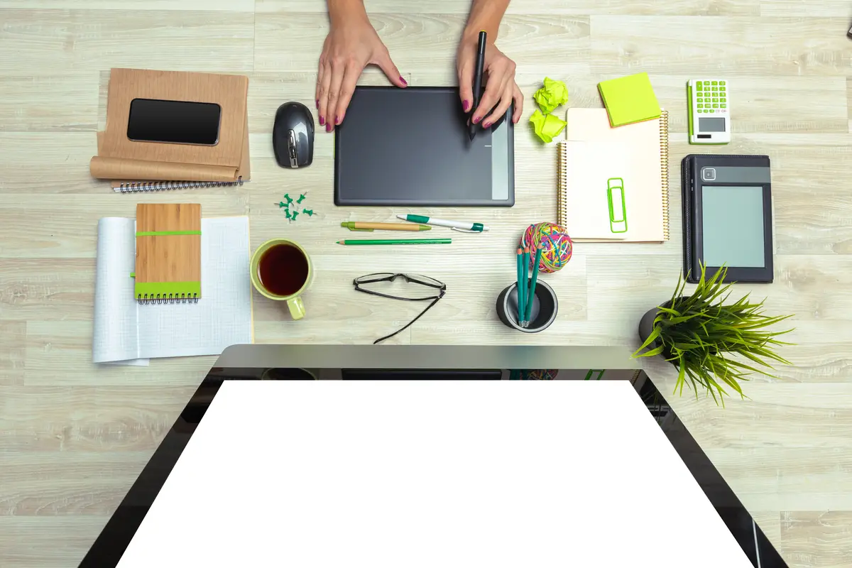 Hand of graphic designer working with stilus and tablet