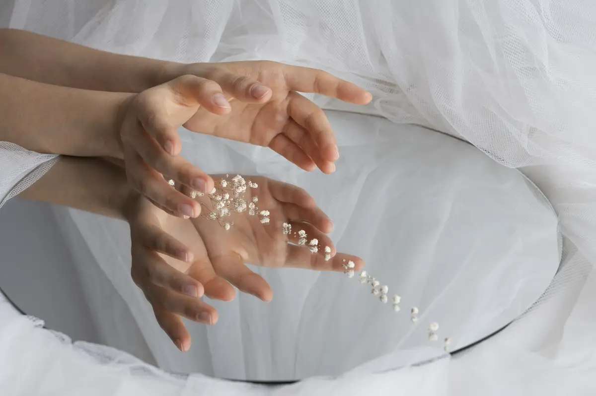 View of human hands with mirror