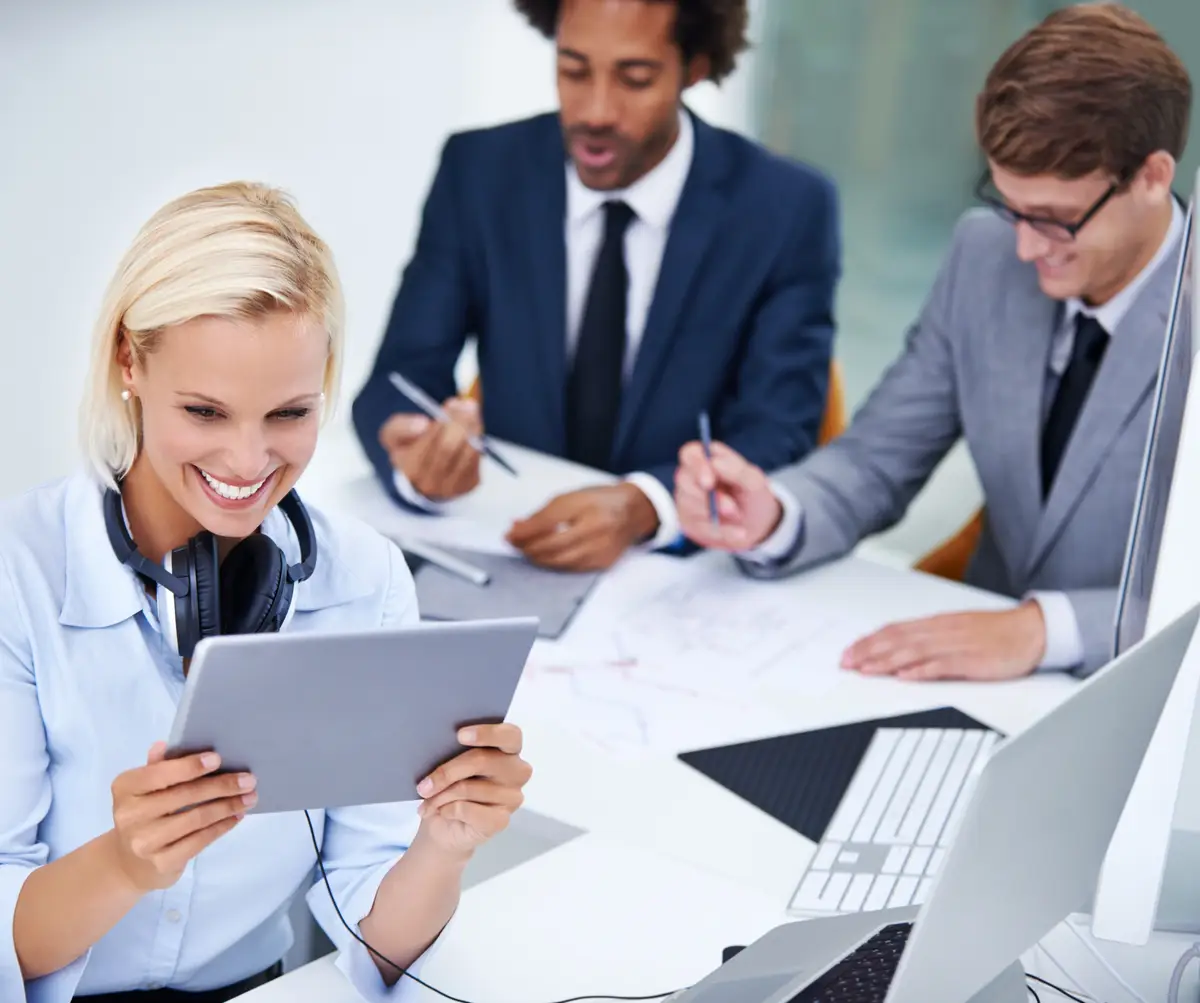 Business woman tablet and happy in office for research communication or legal case information Lawyer technology and people in workplace for corporate news press release or law firm acquisition