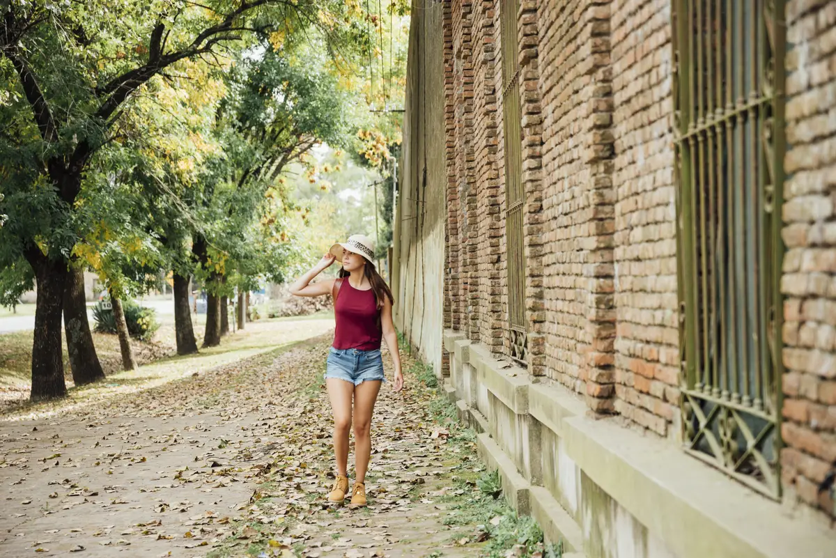 Front view of traveler walking on the sidewalk