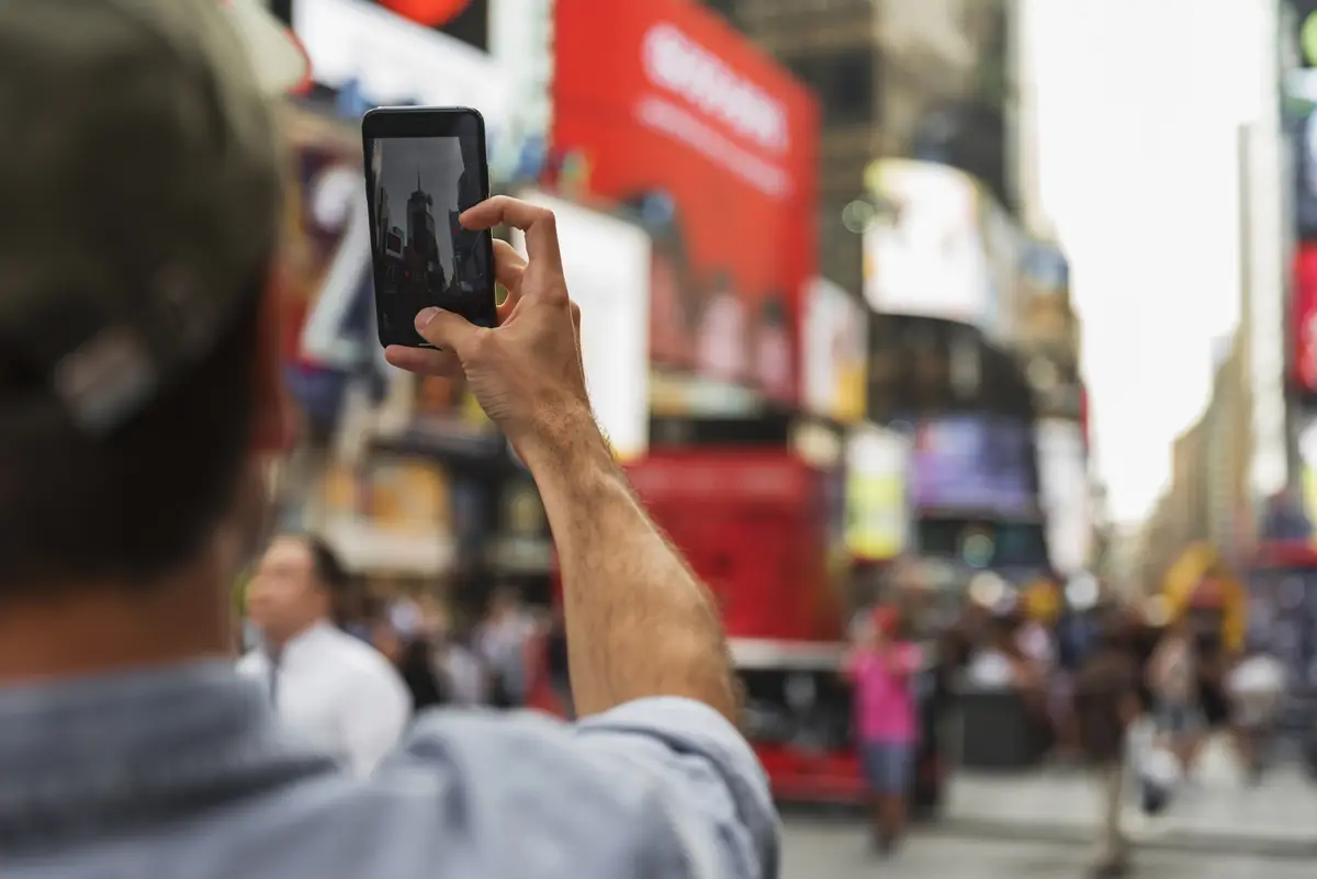 Man in process of taking selfie 