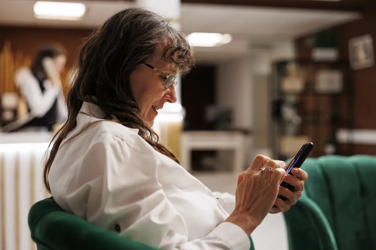 Young woman using mobile phone at home