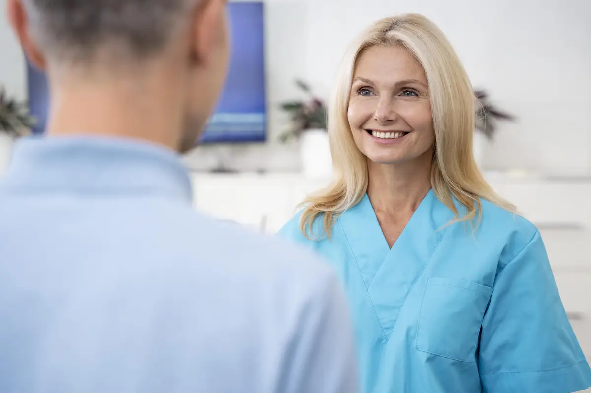 Close up smiley doctor and patient