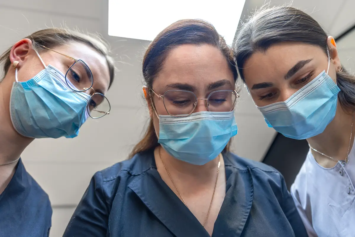 Team of female dentists at work dental treatment closeup portrait of dentists