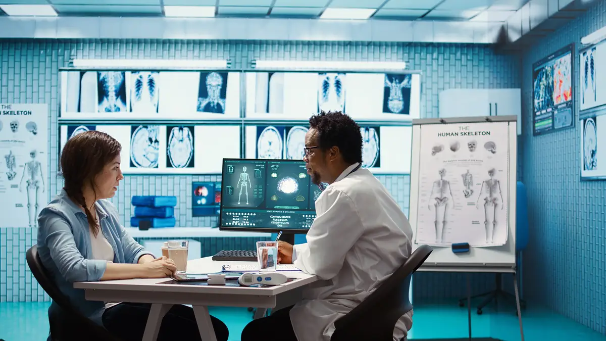 General practitioner presenting the diagnostic report at checkup with patient