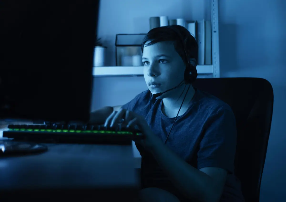 Young boy playing on computer