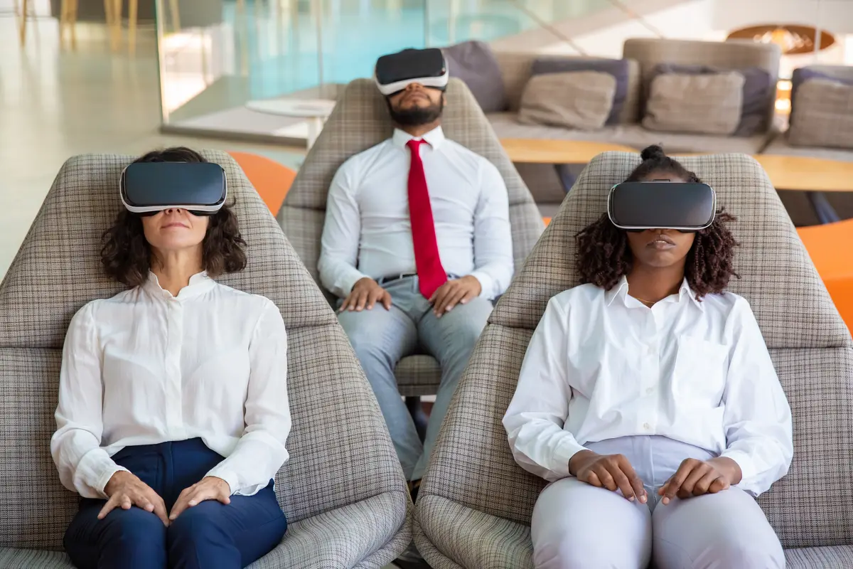 Focused business colleagues in VR headsets