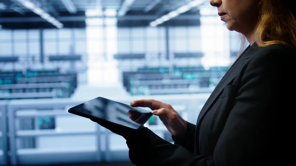 System administrator monitoring server room doing checkup