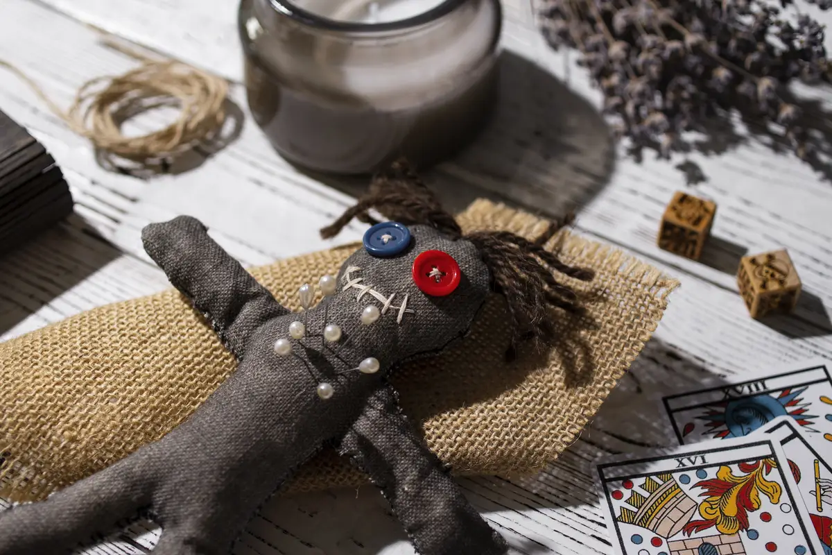 High angle vodoo doll and cards