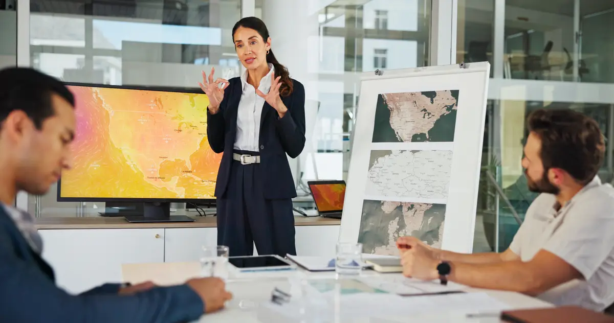 Presentation business woman and map with team for weather pattern seasonal trends and marketing geography Whiteboard meeting and speaker in office with screen climate data and global campaign