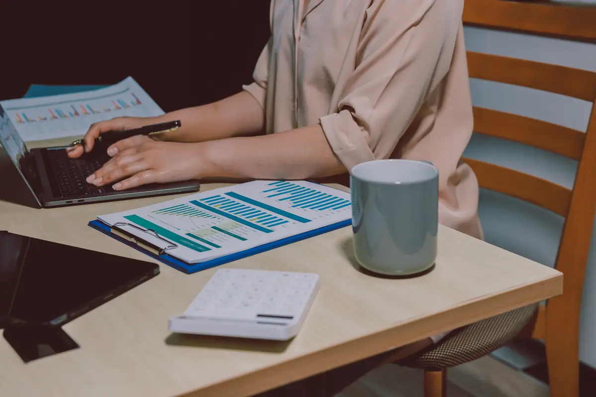 Tax deduction planning concept Women use a calculator to calculate expenses and taxes to receive tax deductions for personal individual Income tax return for individual personsmonthly expenses