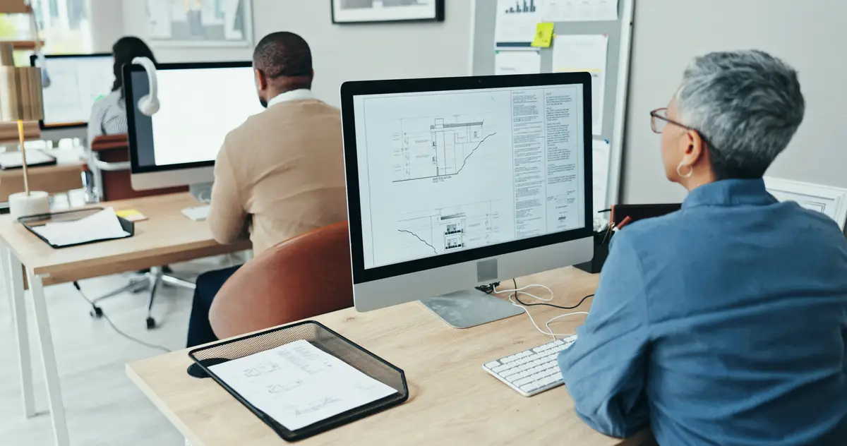 Architect computer screen and employee in office coworking and info for design documents and online Digital display and planning for project architecture and person with blueprint and layout