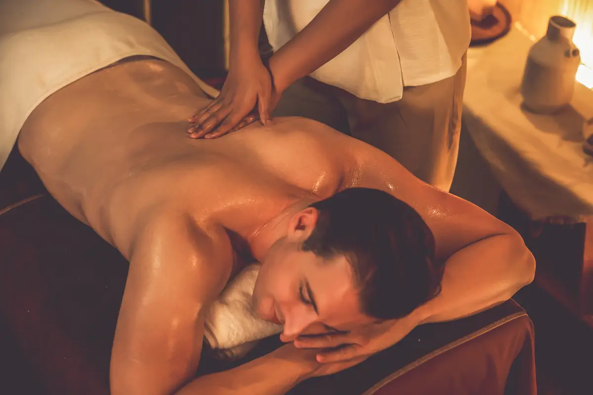 Caucasian man customer enjoying relaxing antistress massage quiescent