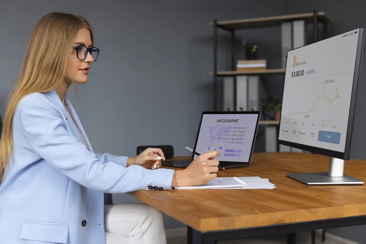 Business person looking at finance graphs