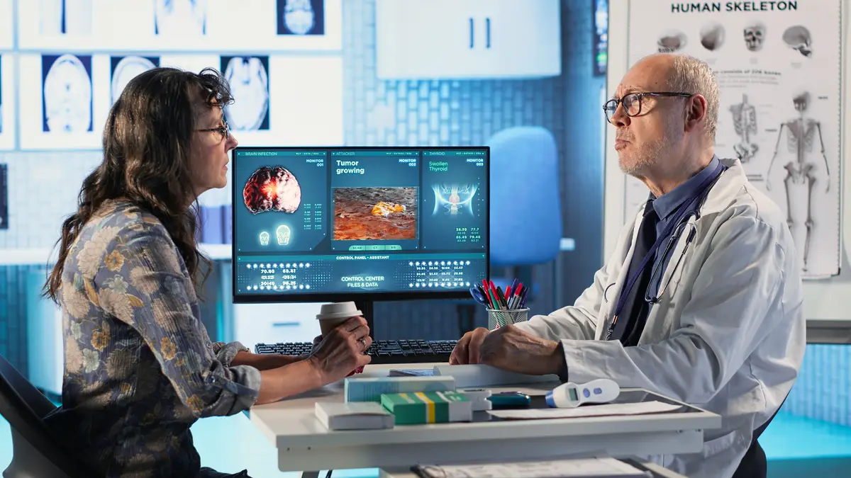 Medical consultation on tumor screening with specialist and elderly patient