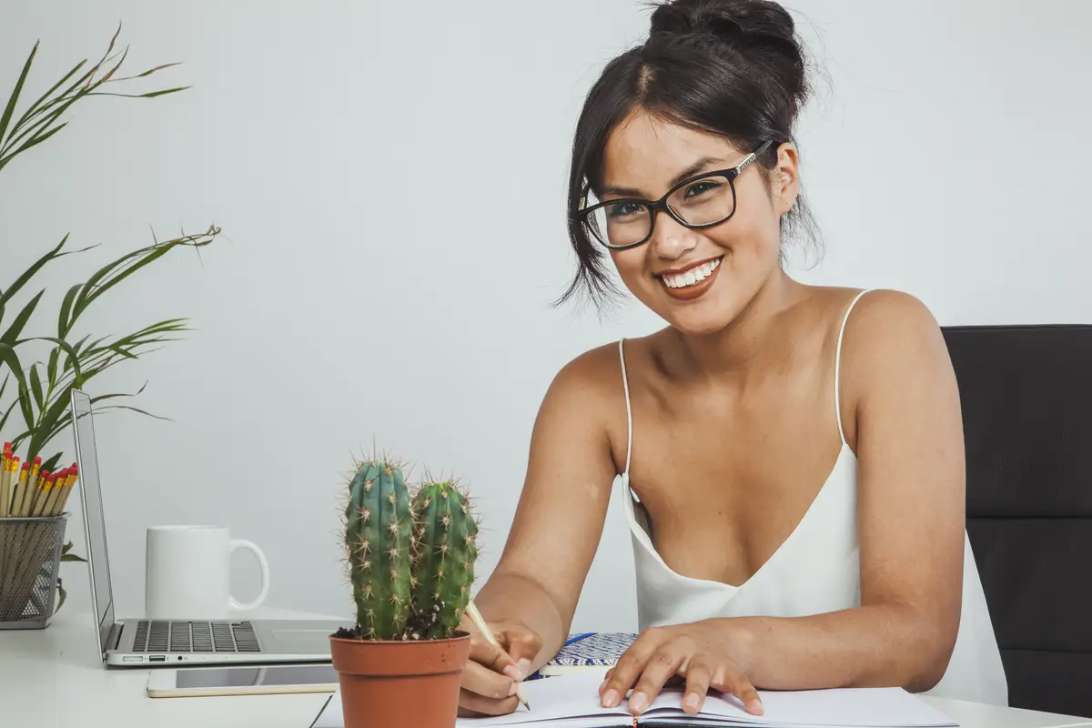 Smiley young woman posing in the office