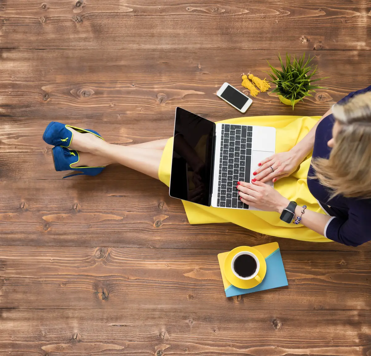 Woman using laptop view from above