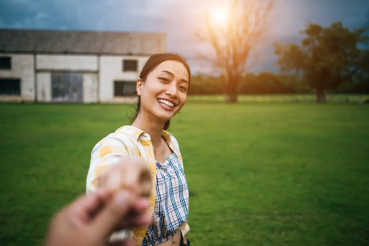 Woman walking on romantic happy holidays holding hand of boyfriend following her