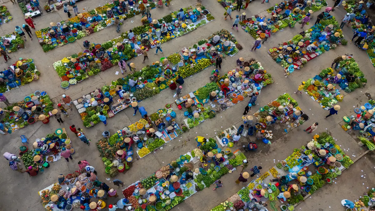 Aerial view of busy local daily life of the morning local market in Vi Thanh or Chom Hom market Vietnam