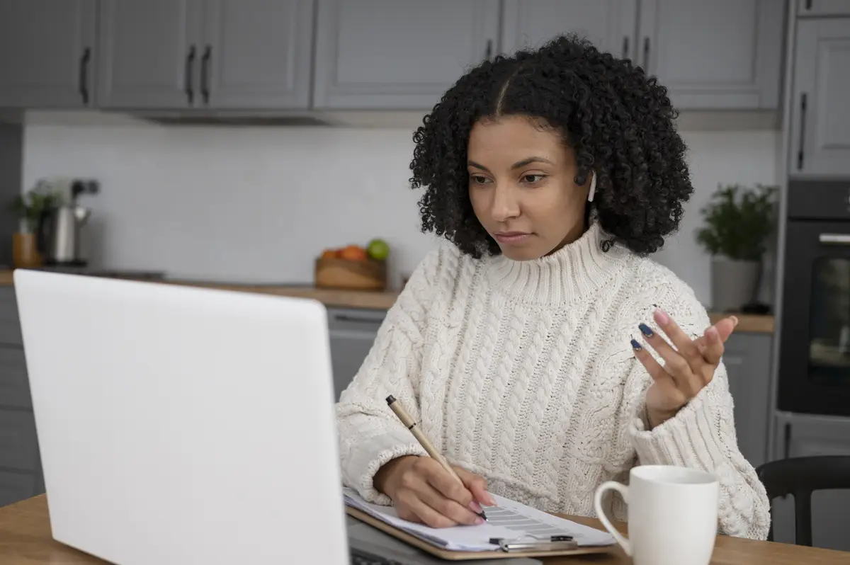 Medium shot woman working at home
