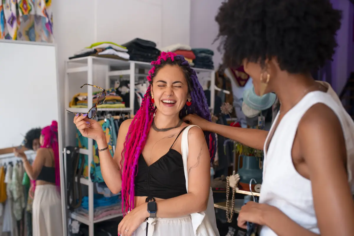 Medium shot women clothes shopping