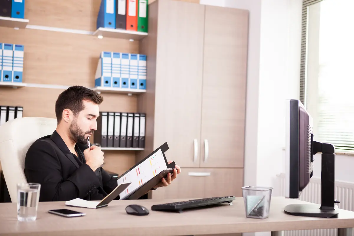 Portrait of Businessman working in his office. Businessperson in professional environment