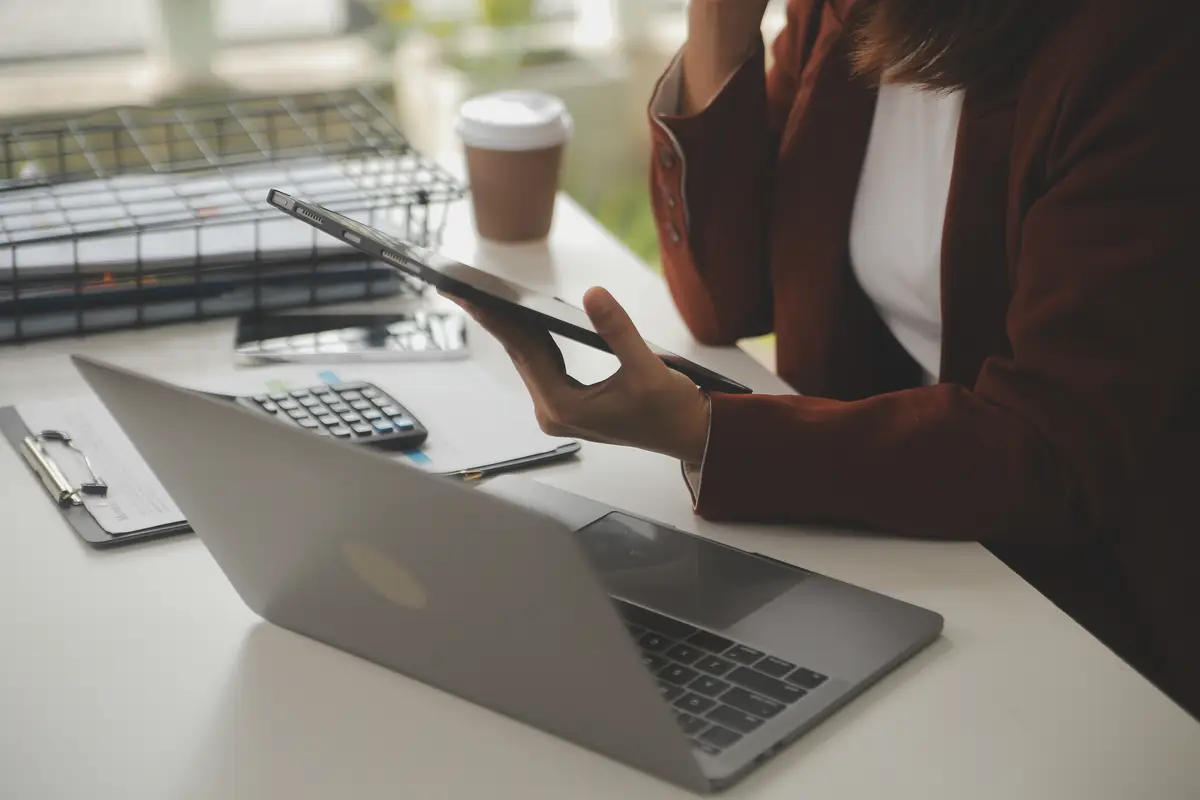 Shot of a asian young business Female working on laptop in her workstation
