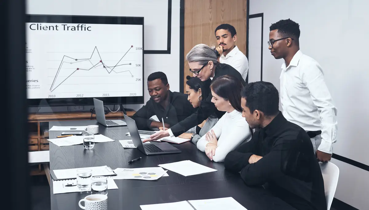 Business people meeting or screen graph presentation with laptop in office for data analytics review or target audience statistics Website traffic erp or digital marketing team with revenue check