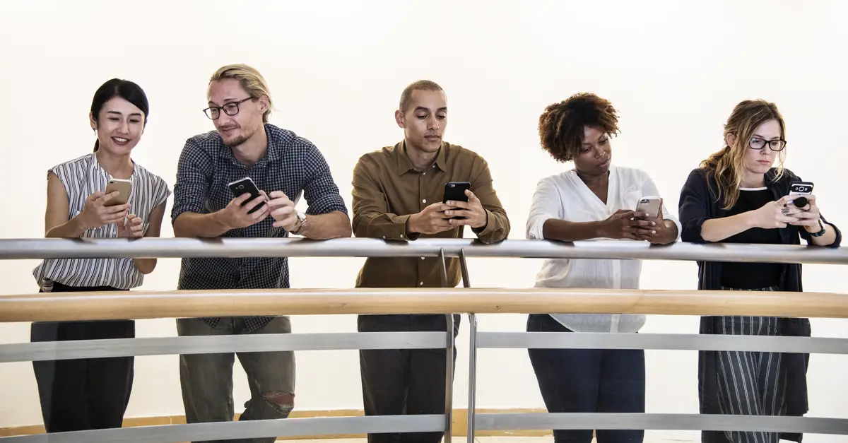 Group of diverse people using smartphones