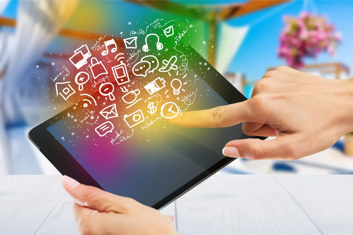 Woman holding digital tablet and touching screen