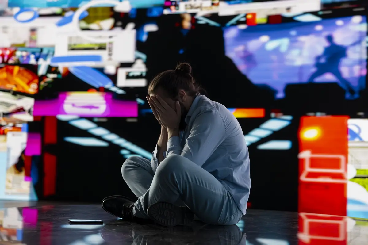 Paranoid guy suffers from emotional damage caused by obsessive social media use
