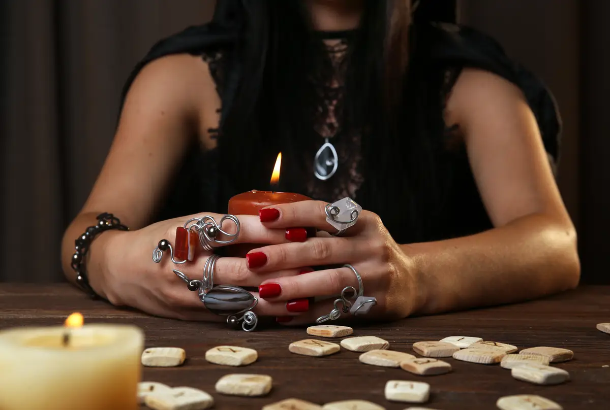 Witch fortune teller on dark background