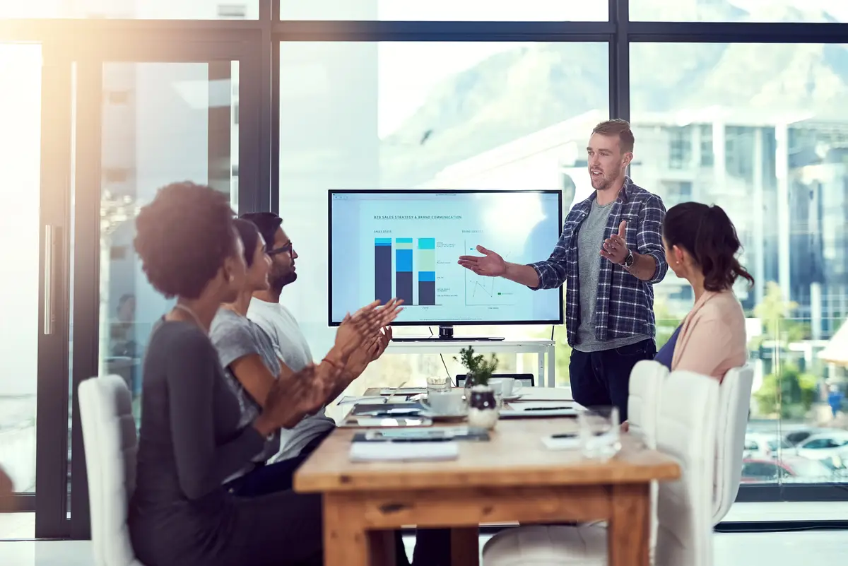 Diversity teamwork and presentation in workplace for collaboration project and leadership Men women and business meeting in office for workshop training and data analysis for startup company