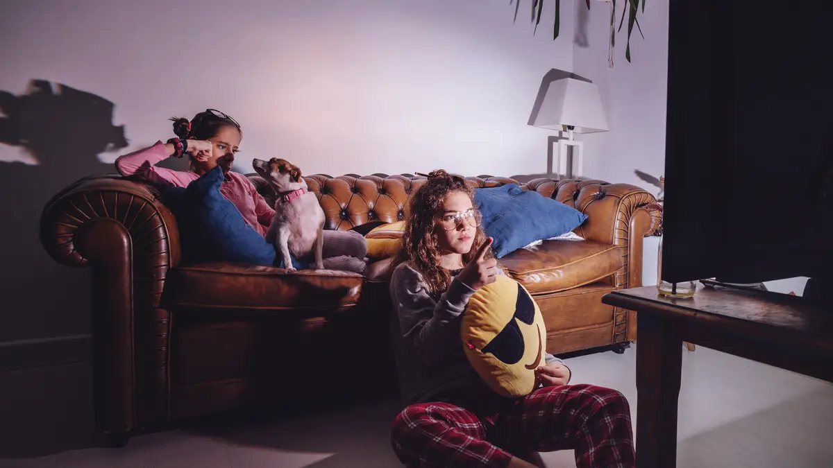 Girls watching TV in evening