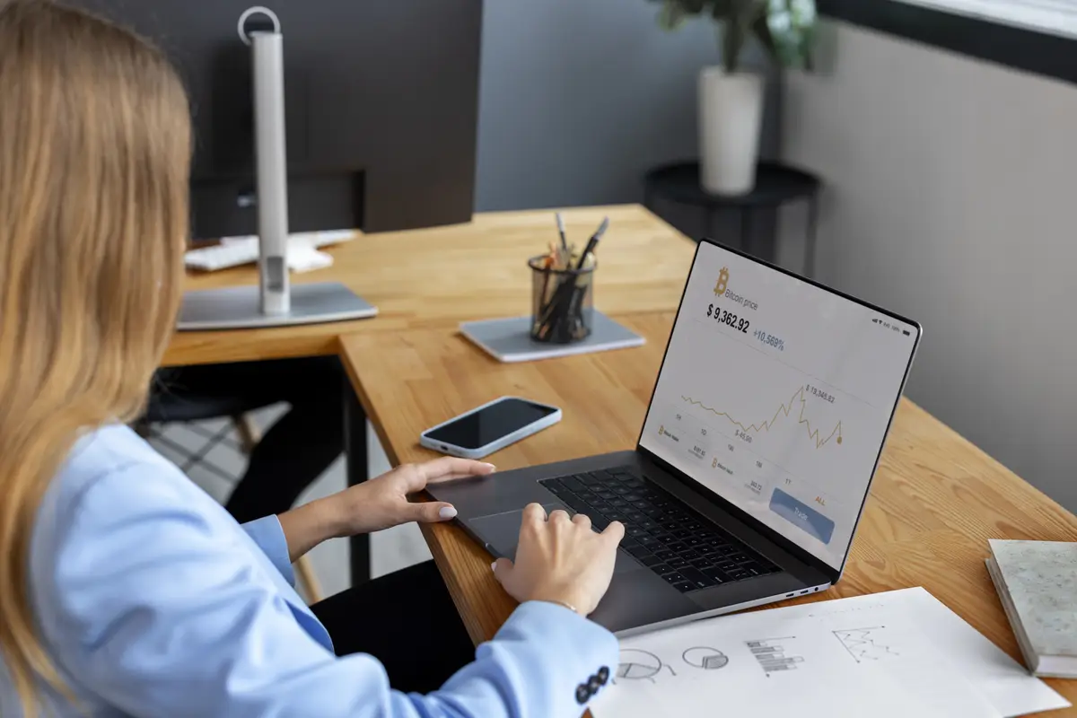 Business person looking at finance graphs