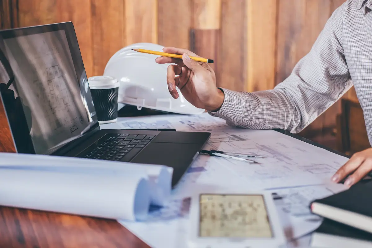Low angle view of man using laptop on table