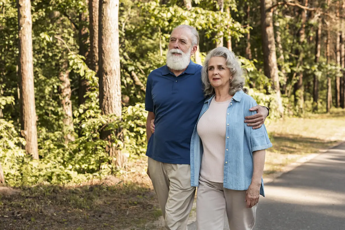 Medium shot senior couple walking together
