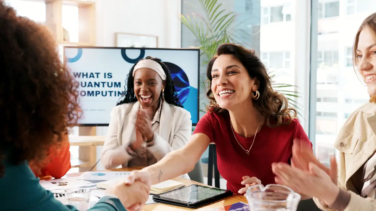 Business people handshake and women in office meeting or presentation for quantum computing Employees smile or shaking hands with cooperation b2b deal or feedback for computer science project