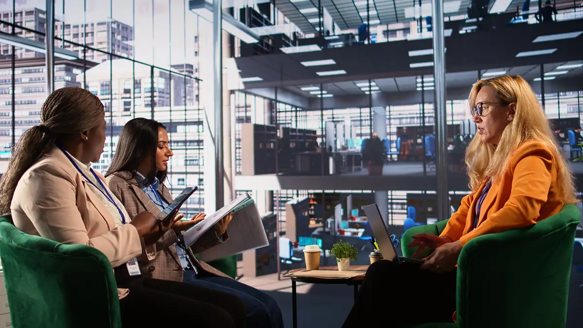 General director reviewing data analytics with her team for successful development plan