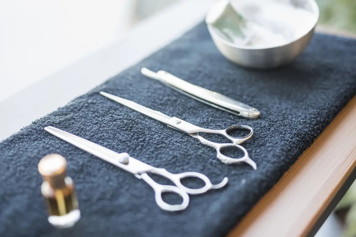 Implements of hairdresser on towel